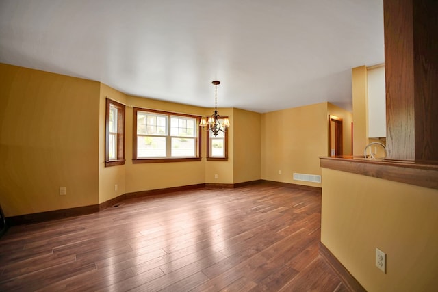 77 Hunters Trl, Wellsboro, PA 16901 - spare room with a chandelier, dark wood finished floors, baseboards, and a sink