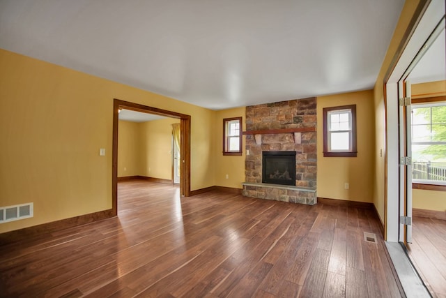 77 Hunters Trl, Wellsboro, PA 16901 - unfurnished living room with dark wood-style floors, healthy amount of natural light, a fireplace, and baseboards