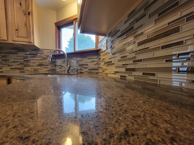 605 Wells Ave, Athens, PA 18810 - kitchen view of a sink, tasteful backsplash, and dark stone counters