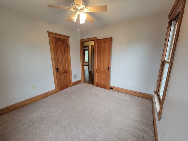 605 Wells Ave, Athens, PA 18810 - unfurnished bedroom with baseboards, carpet, and a ceiling fan