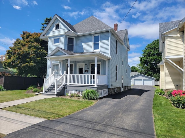 605 Wells Ave, Athens, PA 18810 - view of front of property featuring a porch, a chimney, an outbuilding, a shingled roof, and a detached garage
