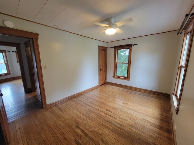 605 Wells Ave, Athens, PA 18810 - unfurnished room featuring light wood-style floors, baseboards, a ceiling fan, crown molding, and a smoke detector