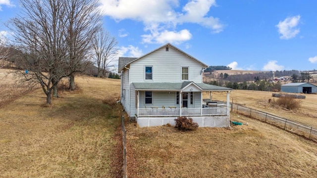 view of front of property with a front lawn and a porch