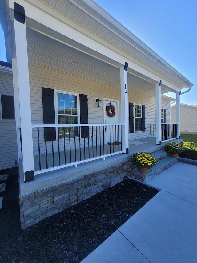 doorway to property with covered porch