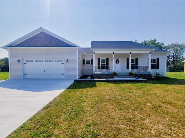 ranch-style home featuring a front lawn, covered porch, and a garage