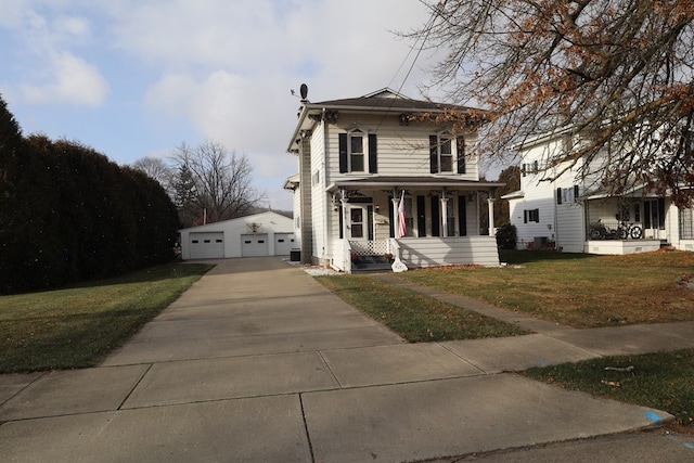 italianate house featuring an outbuilding, a garage, a front lawn, and covered porch