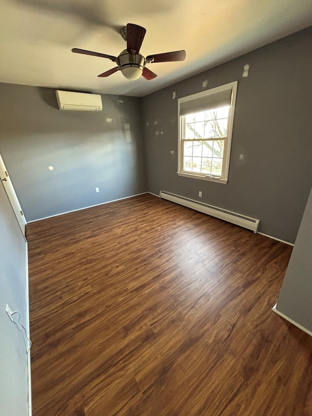 empty room with ceiling fan, dark hardwood / wood-style flooring, an AC wall unit, and baseboard heating