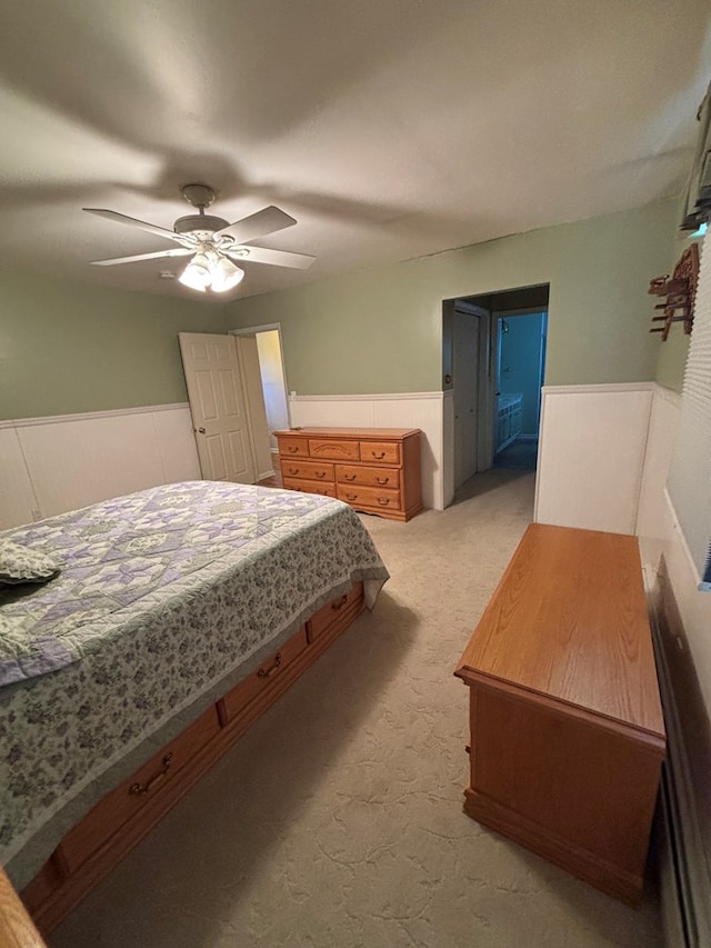 bedroom with light colored carpet and ceiling fan