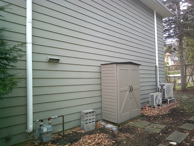 view of outbuilding featuring ac unit and cooling unit