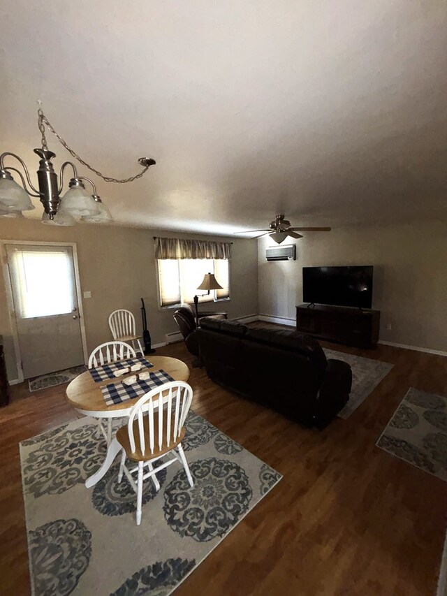 living room with wood-type flooring, a wealth of natural light, and ceiling fan