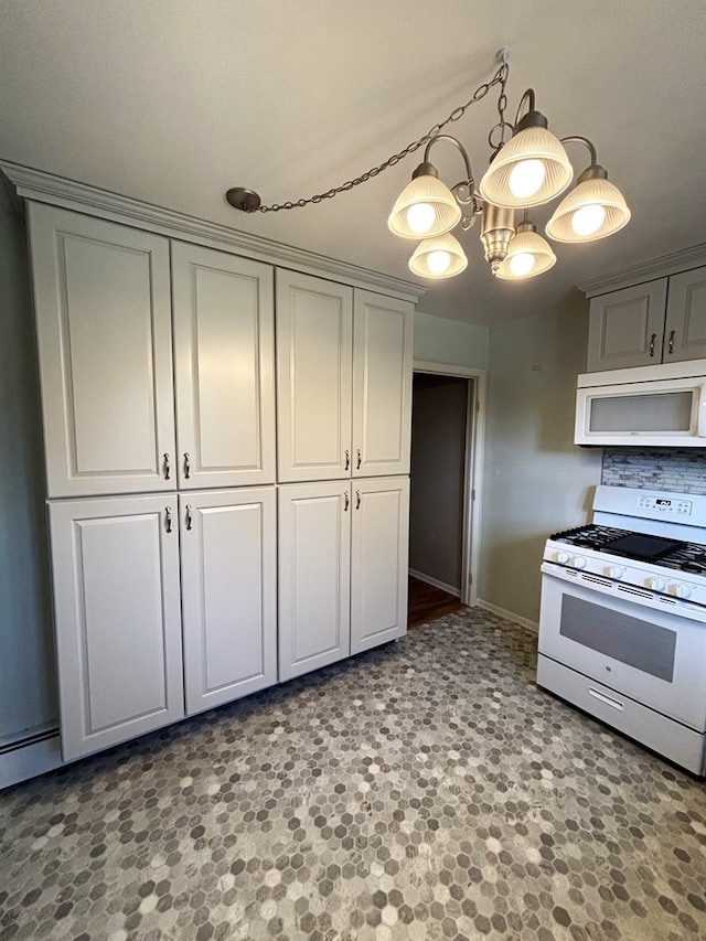 kitchen featuring a chandelier and white appliances