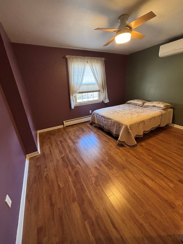 unfurnished bedroom with baseboard heating, ceiling fan, hardwood / wood-style floors, and a wall mounted air conditioner