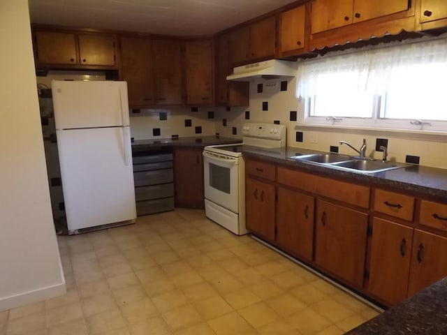 kitchen featuring white appliances and sink