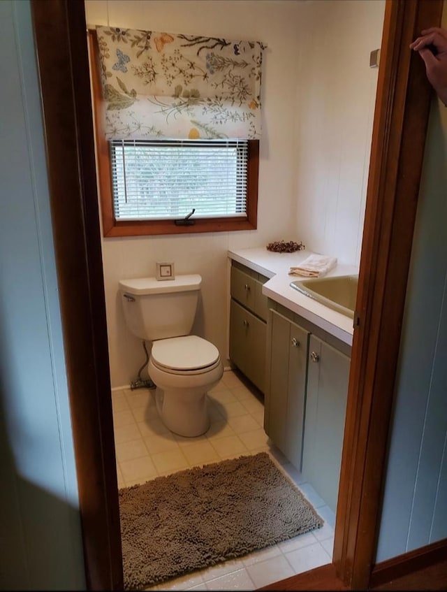 bathroom with tile patterned floors, vanity, and toilet