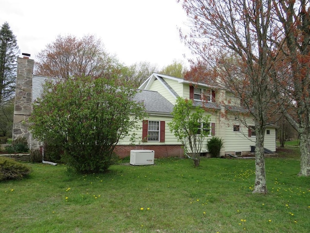 exterior space featuring a yard