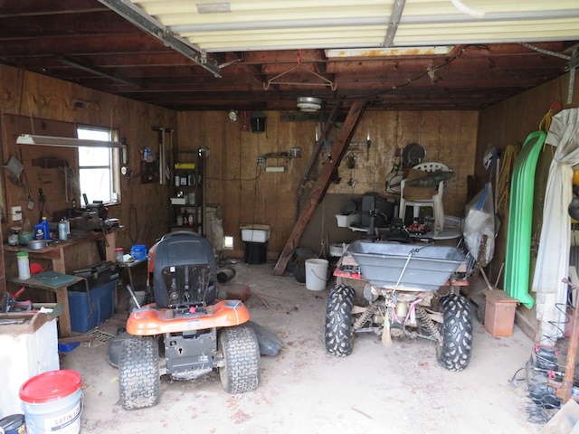 garage featuring wood walls