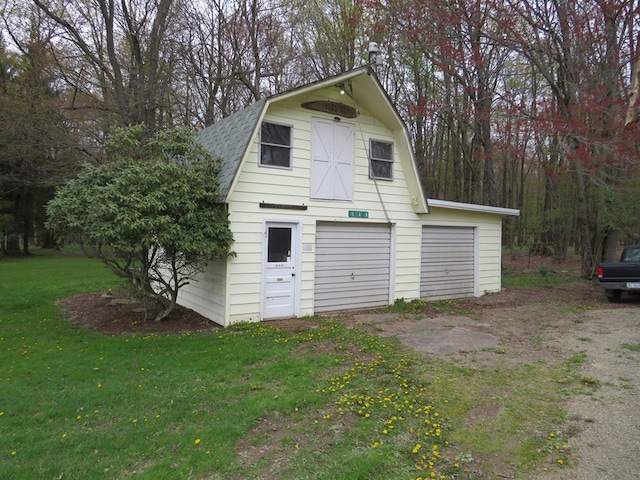 garage with a lawn