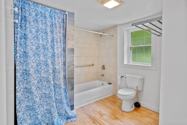 511 Steam Mill Rd, Wellsboro, PA 16901 - bathroom featuring toilet, shower / tub combo with curtain, wood finished floors, and baseboards