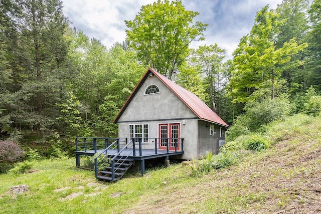 511 Steam Mill Rd, Wellsboro, PA 16901 - rear view of house with a deck, french doors, and a forest view