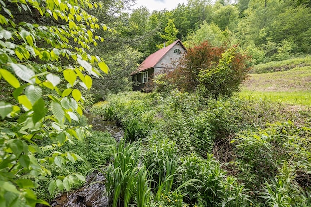 511 Steam Mill Rd, Wellsboro, PA 16901 - view of side of home featuring a wooded view and metal roof