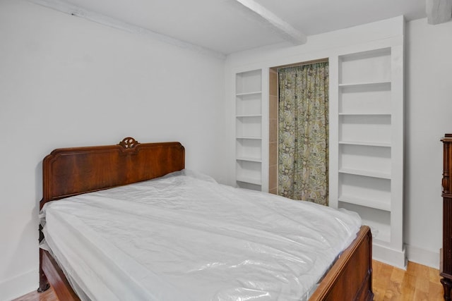 511 Steam Mill Rd, Wellsboro, PA 16901 - bedroom with light wood-type flooring and beam ceiling