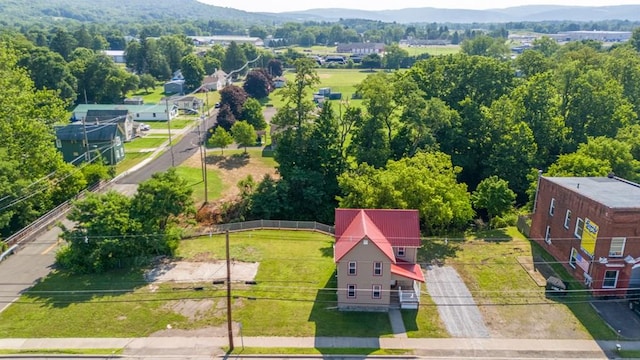 birds eye view of property with a mountain view