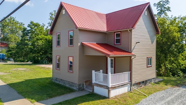 view of front of house with a front lawn and covered porch