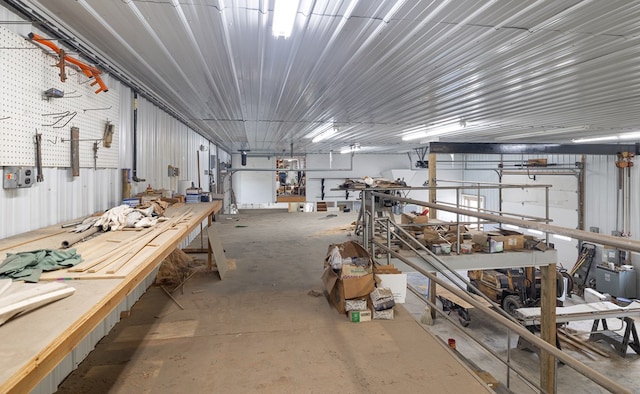 misc room featuring a workshop area and concrete flooring