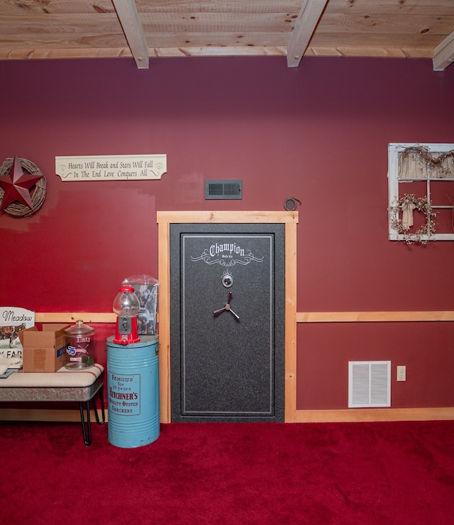 detailed view of beamed ceiling, carpet floors, and wooden ceiling