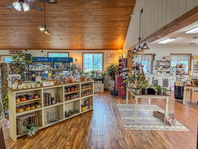 interior space featuring wooden ceiling, a ceiling fan, vaulted ceiling, and wood finished floors