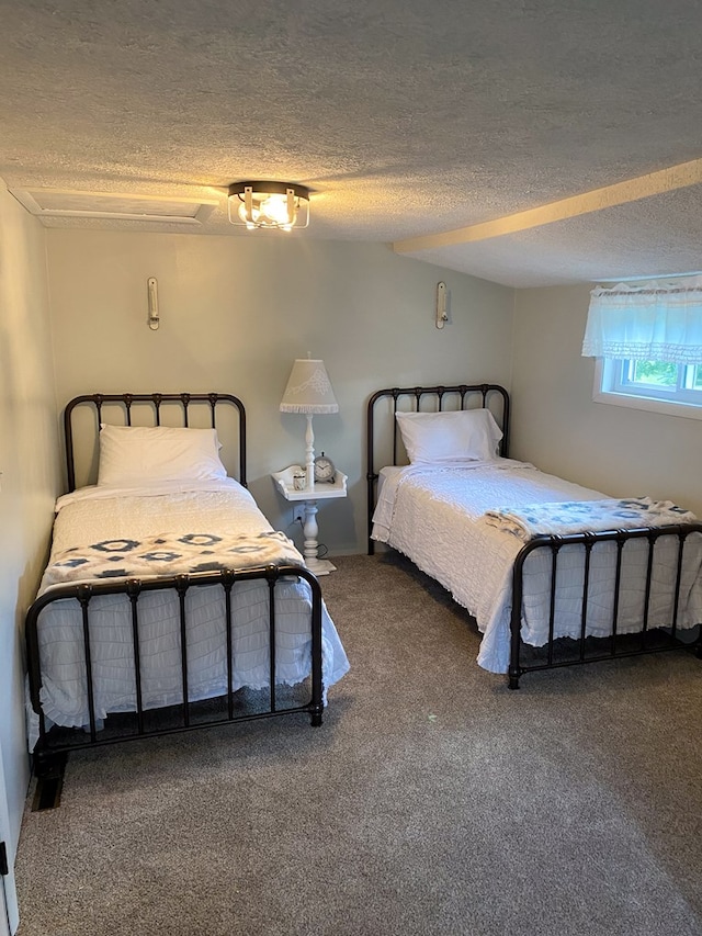 carpeted bedroom featuring a textured ceiling