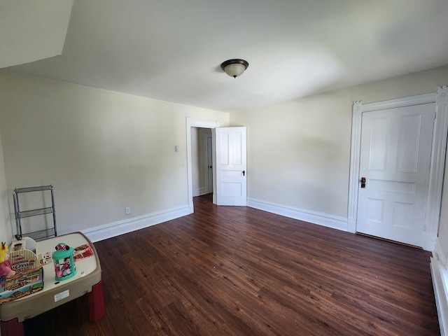 406 E Maple St, Coudersport, PA 16915 - empty room with dark wood-style flooring and baseboards