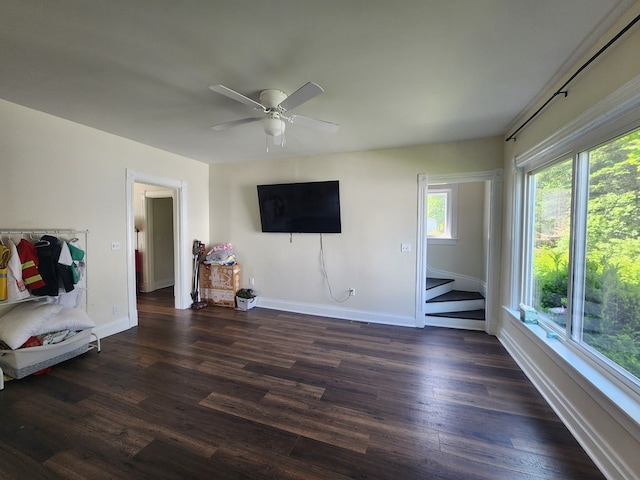 406 E Maple St, Coudersport, PA 16915 - living area featuring dark wood finished floors, a ceiling fan, and stairway