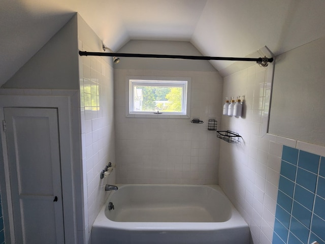 406 E Maple St, Coudersport, PA 16915 - bathroom with lofted ceiling, tile walls, and bathing tub / shower combination