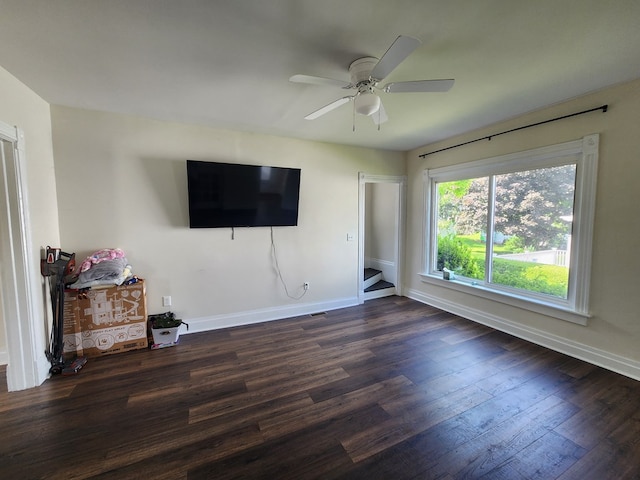 406 E Maple St, Coudersport, PA 16915 - unfurnished living room with wood finished floors, a ceiling fan, and stairs