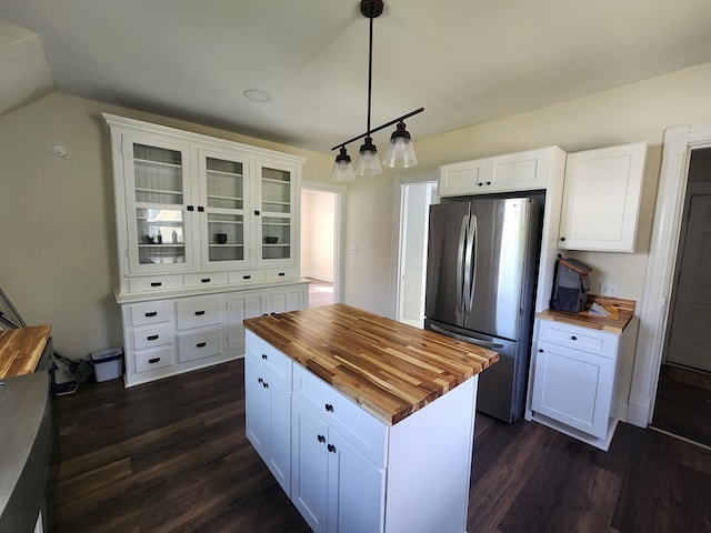 406 E Maple St, Coudersport, PA 16915 - kitchen featuring wooden counters, freestanding refrigerator, dark wood-style flooring, white cabinets, and vaulted ceiling