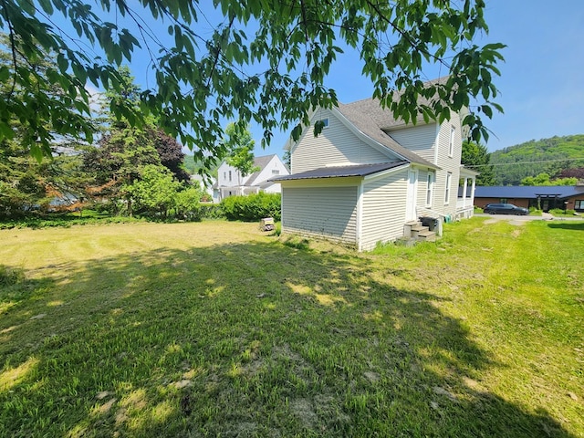 406 E Maple St, Coudersport, PA 16915 - view of home's exterior with a yard