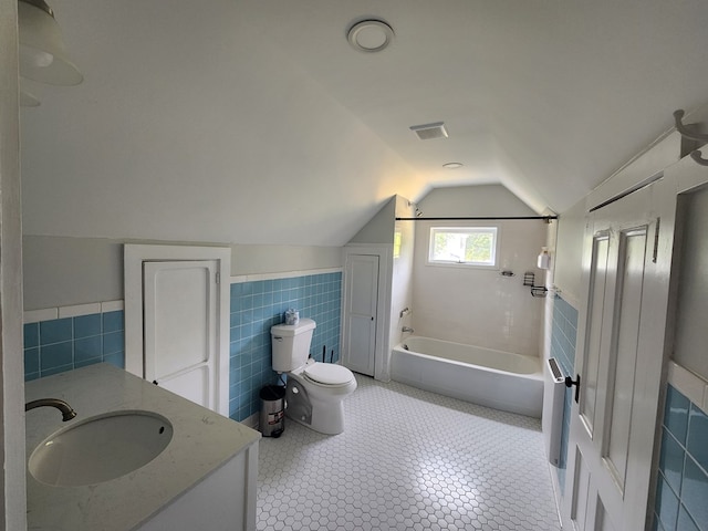 406 E Maple St, Coudersport, PA 16915 - full bath featuring tile walls, vanity, lofted ceiling, shower / bath combination, and wainscoting