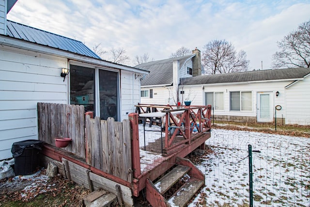 view of snow covered deck