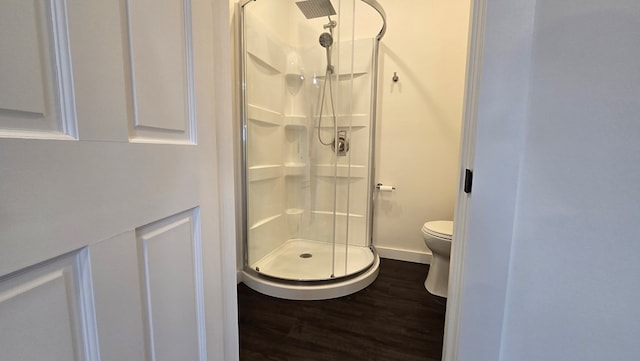 105 Taylor St, Blossburg, PA 16912 - bathroom featuring a stall shower, wood finished floors, toilet, and baseboards