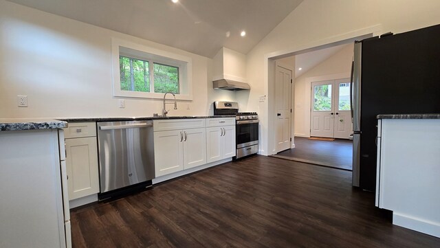 105 Taylor St, Blossburg, PA 16912 - kitchen with appliances with stainless steel finishes, dark wood finished floors, vaulted ceiling, white cabinets, and a sink