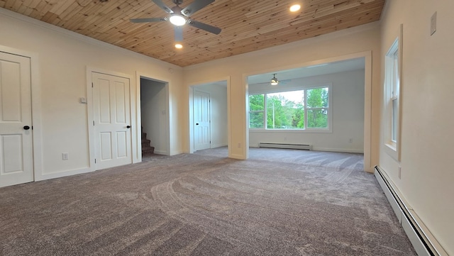 105 Taylor St, Blossburg, PA 16912 - spare room with a baseboard heating unit, a ceiling fan, a baseboard radiator, wooden ceiling, and carpet flooring
