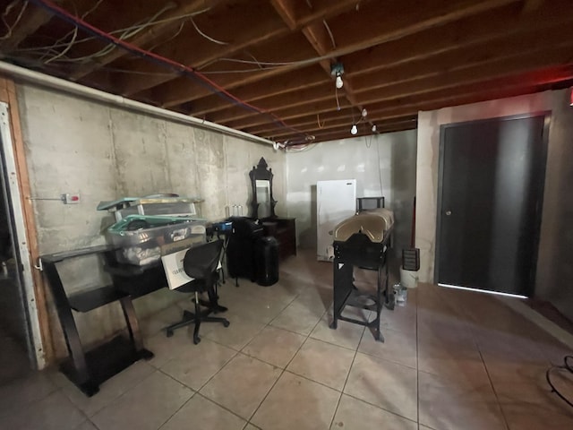 basement featuring tile patterned flooring