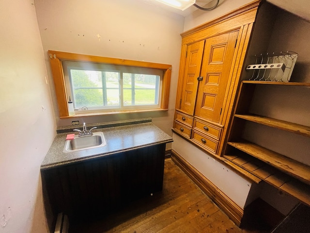 office area with sink and dark hardwood / wood-style floors