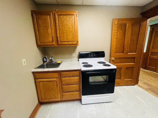 kitchen featuring sink, light wood-type flooring, and white electric stove