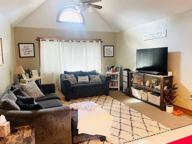 carpeted living room with ceiling fan and lofted ceiling