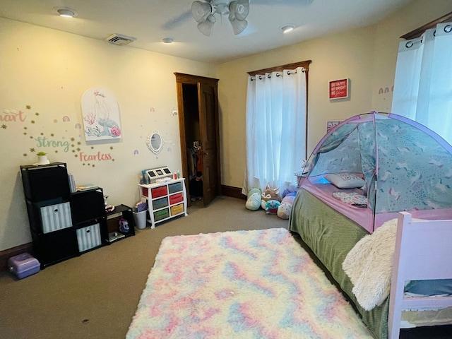 carpeted bedroom with ceiling fan