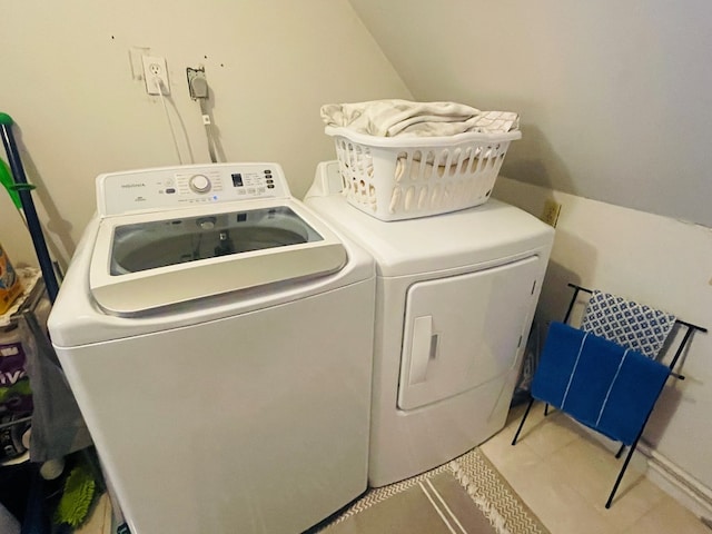 clothes washing area featuring washing machine and clothes dryer