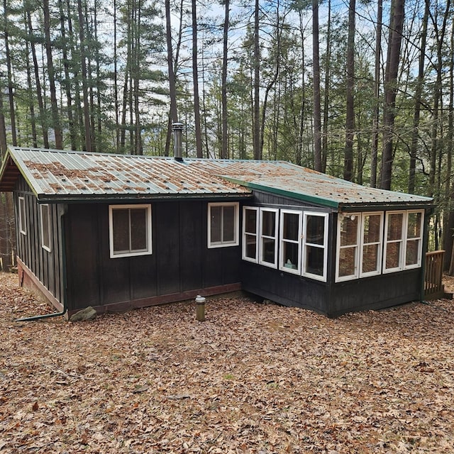 exterior space featuring metal roof