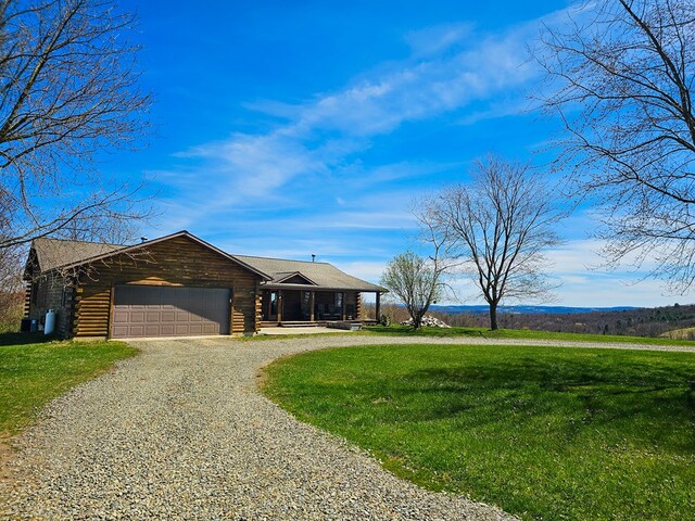 102 Fred Catlin Rd, Owego, NY 13827 - ranch-style home featuring an attached garage, driveway, a front yard, and log exterior